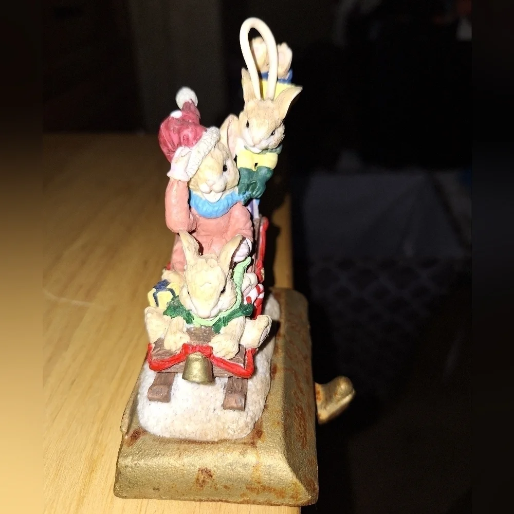 An unbranded Mouse and sleigh stocking holder. The base is 3.75